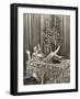 Woman Popping Out of Large Gift Box in Front of Christmas Tree-null-Framed Photo