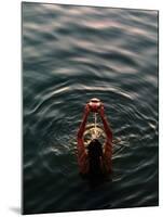 Woman Pouring Water During Morning Puja on Ganges, Varanasi, India-Anthony Plummer-Mounted Photographic Print
