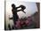 Woman Pouring Water Over Flowers on an Altar as a Religious Ritual, Varanasi, India-Eitan Simanor-Stretched Canvas