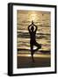 Woman practising yoga meditation on beach at sunset as concept for silence and relaxation-Godong-Framed Photographic Print