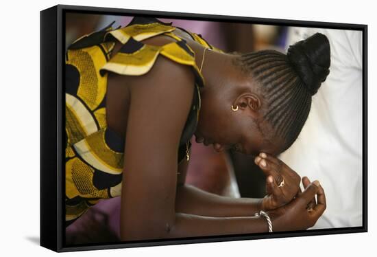 Woman praying at mass in Popenguine, Popenguine, Thies, Senegal-Godong-Framed Stretched Canvas