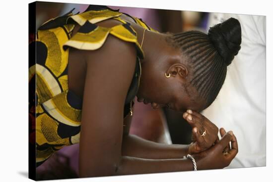 Woman praying at mass in Popenguine, Popenguine, Thies, Senegal-Godong-Stretched Canvas