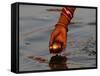 Woman Praying on the Banks of the River Ganges Fills Water into a Copper Vessel for a Ritual-null-Framed Stretched Canvas