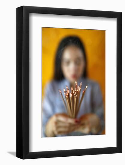 Woman praying with incense sticks in hands, Thien Hung Buddhist temple (Saigon)-Godong-Framed Photographic Print
