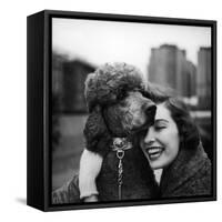 Woman Profiling a Big Smile While Adoring Her Poodle Wearing Large Swiss Watch on Dog Collar-Yale Joel-Framed Stretched Canvas