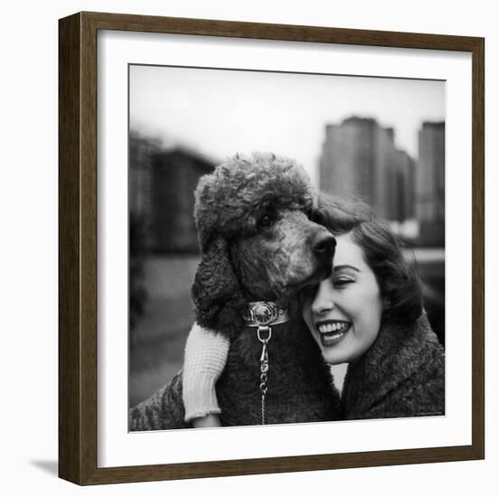 Woman Profiling a Big Smile While Adoring Her Poodle Wearing Large Swiss Watch on Dog Collar-Yale Joel-Framed Photographic Print