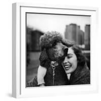 Woman Profiling a Big Smile While Adoring Her Poodle Wearing Large Swiss Watch on Dog Collar-Yale Joel-Framed Photographic Print