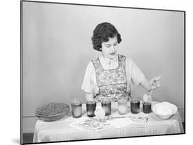 Woman Pulling Egg from Glass/Coloring-Philip Gendreau-Mounted Photographic Print