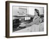 Woman Putting Dishes in Cabinet-Philip Gendreau-Framed Photographic Print