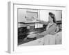 Woman Putting Dishes in Cabinet-Philip Gendreau-Framed Photographic Print