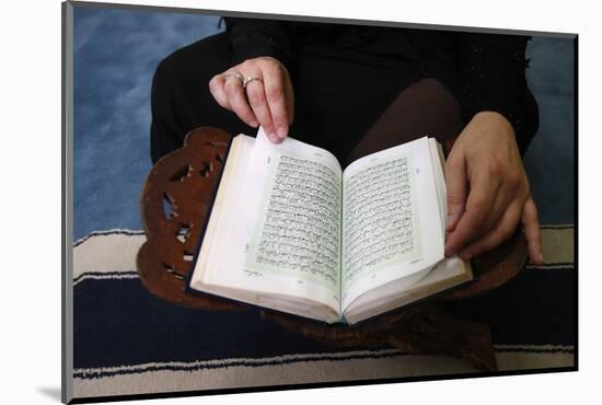 Woman reading Koran in Jumeirah mosque, Dubai, United Arab Emirates-Godong-Mounted Photographic Print