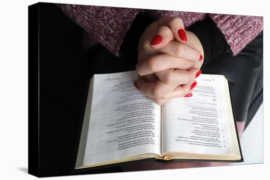 Woman reading the Bible at home, France, Europe-Godong-Stretched Canvas