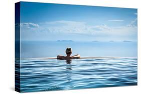 Woman Relaxing in Infinity Swimming Pool on Vacation-Splendens-Stretched Canvas