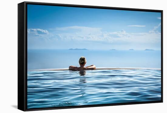 Woman Relaxing in Infinity Swimming Pool on Vacation-Splendens-Framed Stretched Canvas