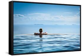 Woman Relaxing in Infinity Swimming Pool on Vacation-Splendens-Framed Stretched Canvas