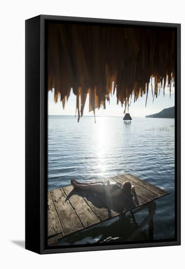 Woman Relaxing on Dock, El Remate, Lago Peten Itza, Guatemala, Central America-Colin Brynn-Framed Stretched Canvas