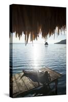 Woman Relaxing on Dock, El Remate, Lago Peten Itza, Guatemala, Central America-Colin Brynn-Stretched Canvas