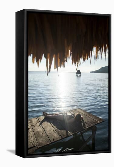 Woman Relaxing on Dock, El Remate, Lago Peten Itza, Guatemala, Central America-Colin Brynn-Framed Stretched Canvas