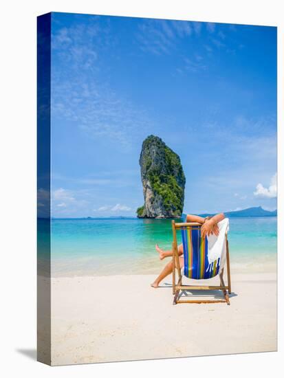 Woman Relaxing on the Beach on a Sunbed in Thailand-Netfalls-Stretched Canvas