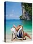 Woman Relaxing on the Beach on a Sunbed in Thailand-Netfalls-Stretched Canvas