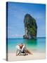 Woman Relaxing on the Beach on a Sunbed in Thailand-Netfalls-Stretched Canvas