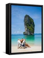 Woman Relaxing on the Beach on a Sunbed in Thailand-Netfalls-Framed Stretched Canvas