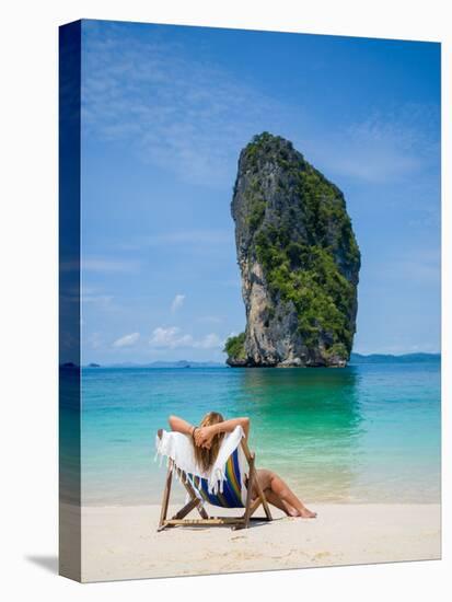 Woman Relaxing on the Beach on a Sunbed in Thailand-Netfalls-Stretched Canvas