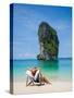 Woman Relaxing on the Beach on a Sunbed in Thailand-Netfalls-Stretched Canvas