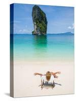 Woman Relaxing on the Beach on a Sunbed in Thailand-Netfalls-Stretched Canvas