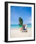 Woman Relaxing on the Beach on a Sunbed in Thailand-Netfalls-Framed Photographic Print