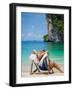 Woman Relaxing on the Beach on a Sunbed in Thailand-Netfalls-Framed Photographic Print