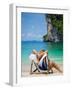 Woman Relaxing on the Beach on a Sunbed in Thailand-Netfalls-Framed Photographic Print