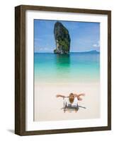 Woman Relaxing on the Beach on a Sunbed in Thailand-Netfalls-Framed Photographic Print