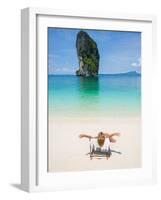 Woman Relaxing on the Beach on a Sunbed in Thailand-Netfalls-Framed Photographic Print