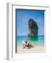 Woman Relaxing on the Beach on a Sunbed in Thailand-Netfalls-Framed Photographic Print