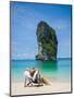 Woman Relaxing on the Beach on a Sunbed in Thailand-Netfalls-Mounted Photographic Print