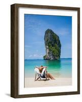 Woman Relaxing on the Beach on a Sunbed in Thailand-Netfalls-Framed Photographic Print