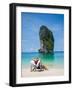 Woman Relaxing on the Beach on a Sunbed in Thailand-Netfalls-Framed Photographic Print