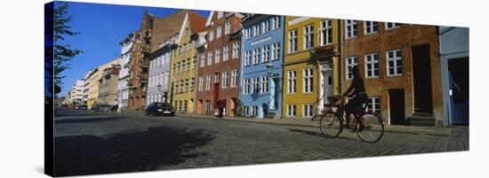 Woman Riding a Bicycle, Copenhagen, Denmark-null-Stretched Canvas