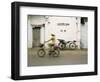 Woman Riding Bicycle Along Street, Ben Tre, Vietnam-Ian Trower-Framed Photographic Print