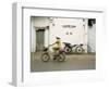 Woman Riding Bicycle Along Street, Ben Tre, Vietnam-Ian Trower-Framed Photographic Print