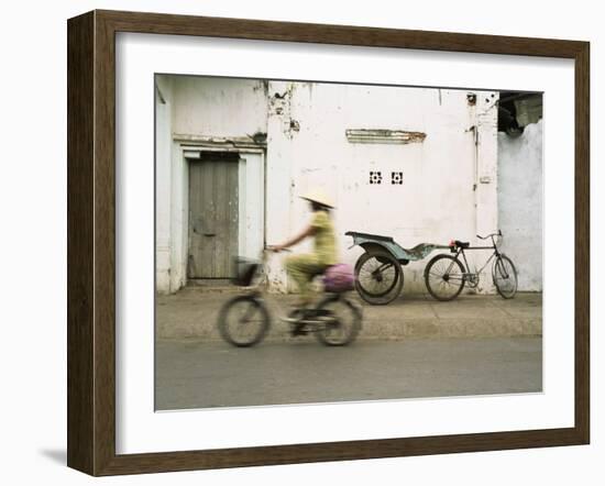 Woman Riding Bicycle Along Street, Ben Tre, Vietnam-Ian Trower-Framed Photographic Print