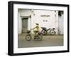 Woman Riding Bicycle Along Street, Ben Tre, Vietnam-Ian Trower-Framed Photographic Print