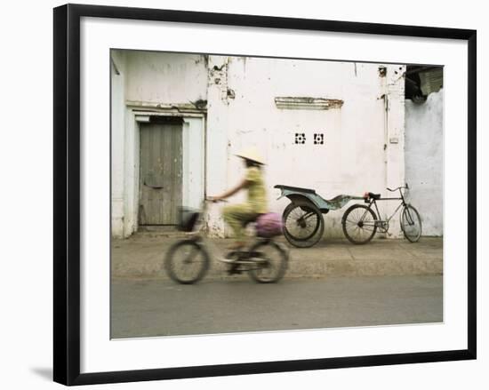 Woman Riding Bicycle Along Street, Ben Tre, Vietnam-Ian Trower-Framed Photographic Print