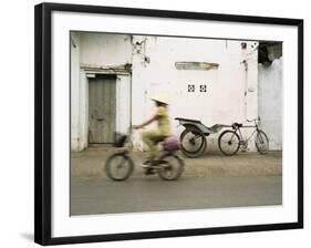 Woman Riding Bicycle Along Street, Ben Tre, Vietnam-Ian Trower-Framed Photographic Print