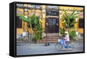 Woman Riding Bicycle Past Restaurant, Hoi an (Unesco World Heritage Site), Quang Ham, Vietnam-Ian Trower-Framed Stretched Canvas