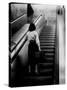 Woman Riding on Escalator in the Time and Life Building-Nina Leen-Stretched Canvas