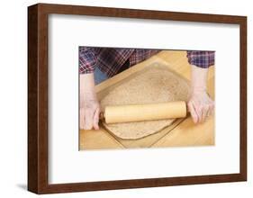 Woman rolling ball of bread dough with a rolling pin, prior to forming it into a loaf.-Janet Horton-Framed Photographic Print