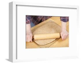 Woman rolling ball of bread dough with a rolling pin, prior to forming it into a loaf.-Janet Horton-Framed Photographic Print