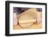 Woman rolling ball of bread dough with a rolling pin, prior to forming it into a loaf.-Janet Horton-Framed Photographic Print